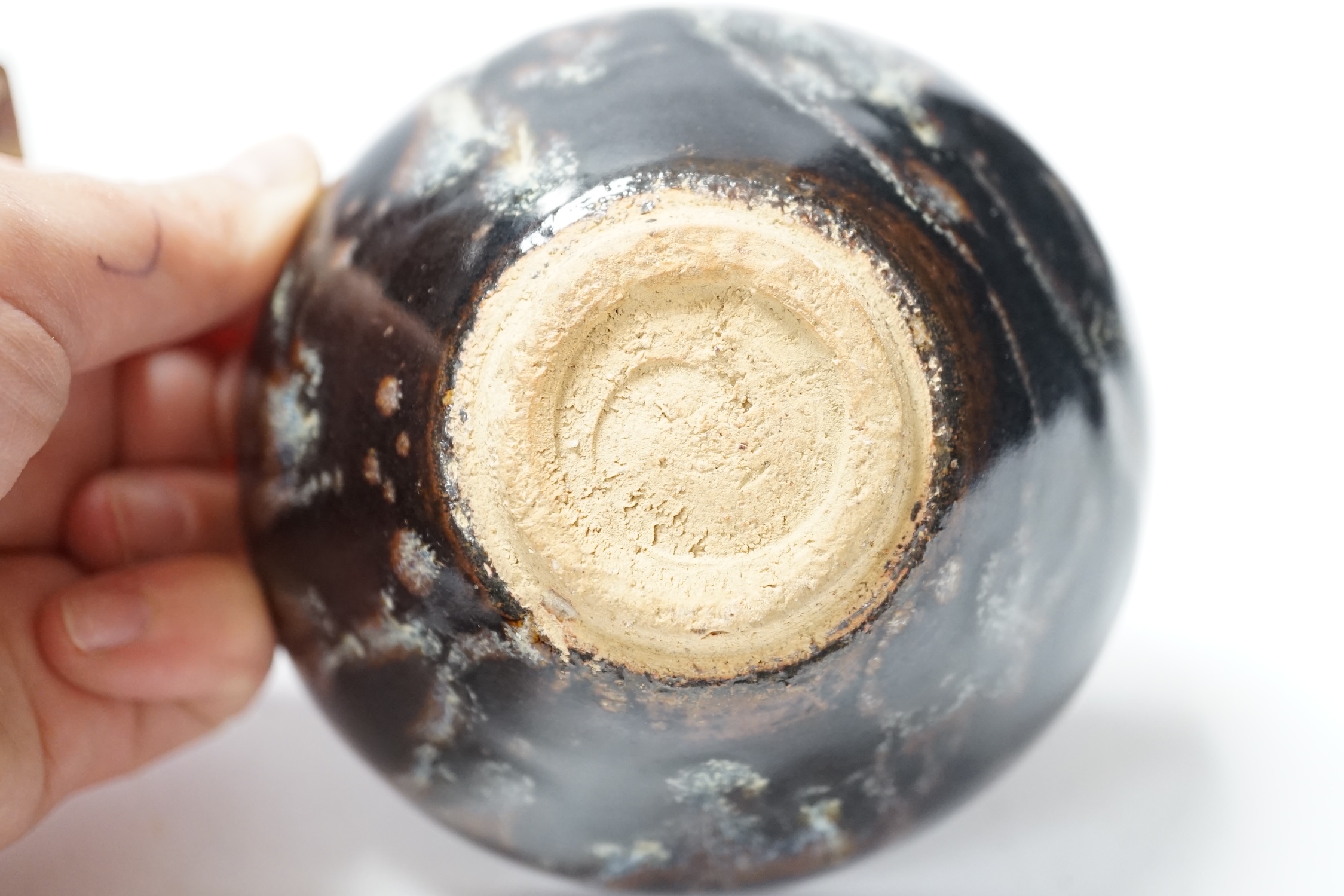 A large Chinese carved soapstone ‘lion dog’ seal and a ‘hares fur’ bowl, largest 17cm. Condition - fair
